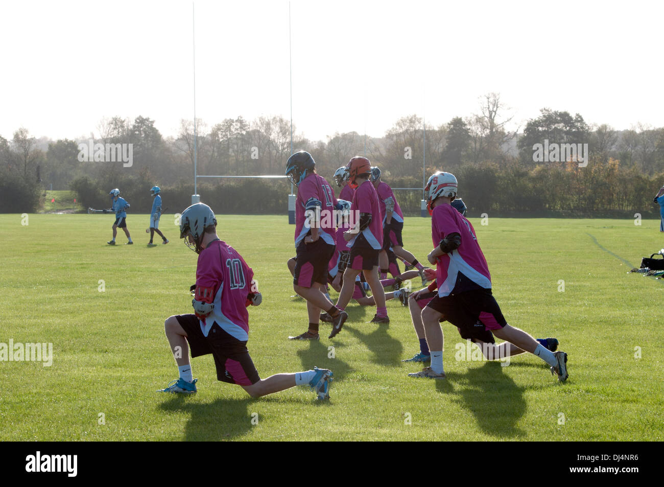 University sport, men`s lacrosse players doing warming up exercises